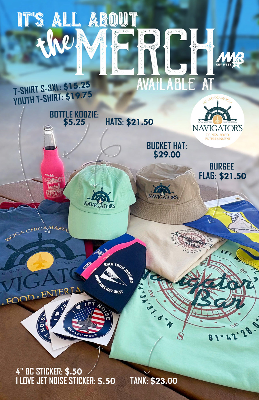 Merchandise display on a beach for Navigator's Bar featuring colorful hats (\$17.50), bucket hat (\$29), t-shirts sizes S–3XL (\$20), burgee flag (\$22.50), bottle koozie (\$5.25), and stickers (\$0.50), with boats and sand in the background.